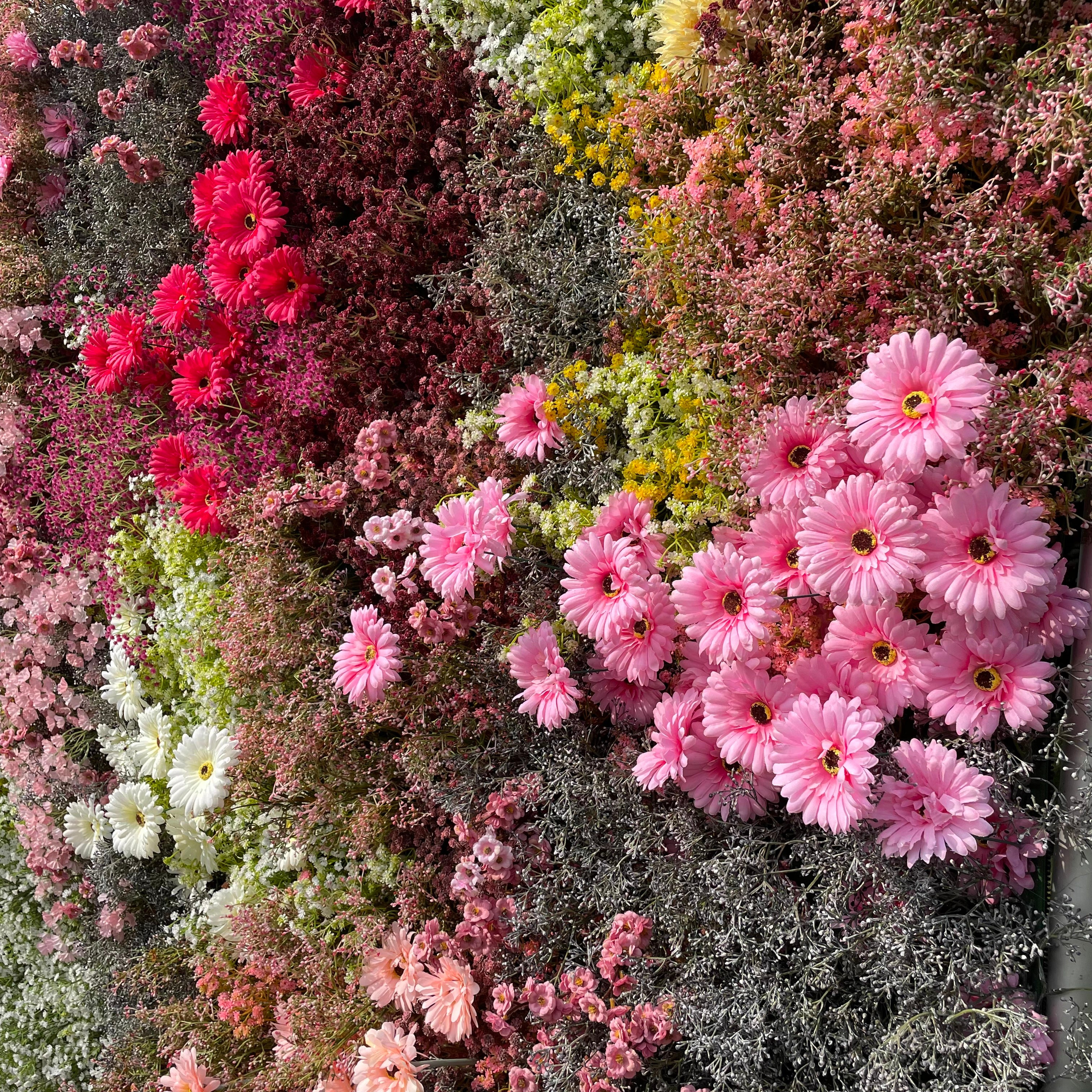 Rose Morning“The flower walls are made of artificial flowers in various colors, layered at different levels to create a lush, elegant and natural look. The exclusive zipper design and roll-up design make it easy to install and remove.”