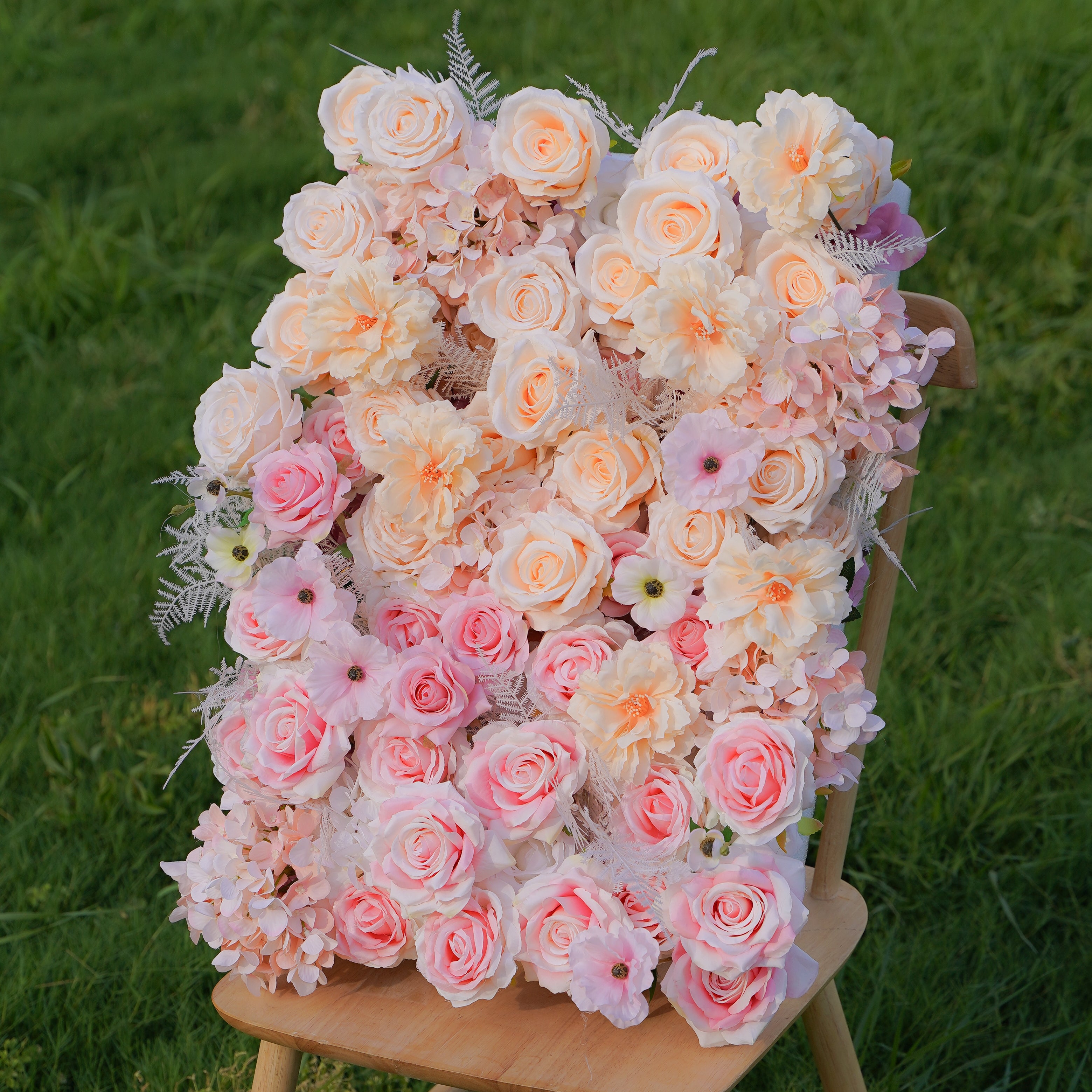 This is a photo of a rose morning danilia wall. The flower wall is made of 5D fabric, hand rolled and measures 8ft x 8ft. The flower wall is composed of bright roses, creating a romantic and elegant atmosphere. The flower wall is suitable for various occasions, such as weddings, parties, birthday parties, etc. It is also perfect for decorating your home.