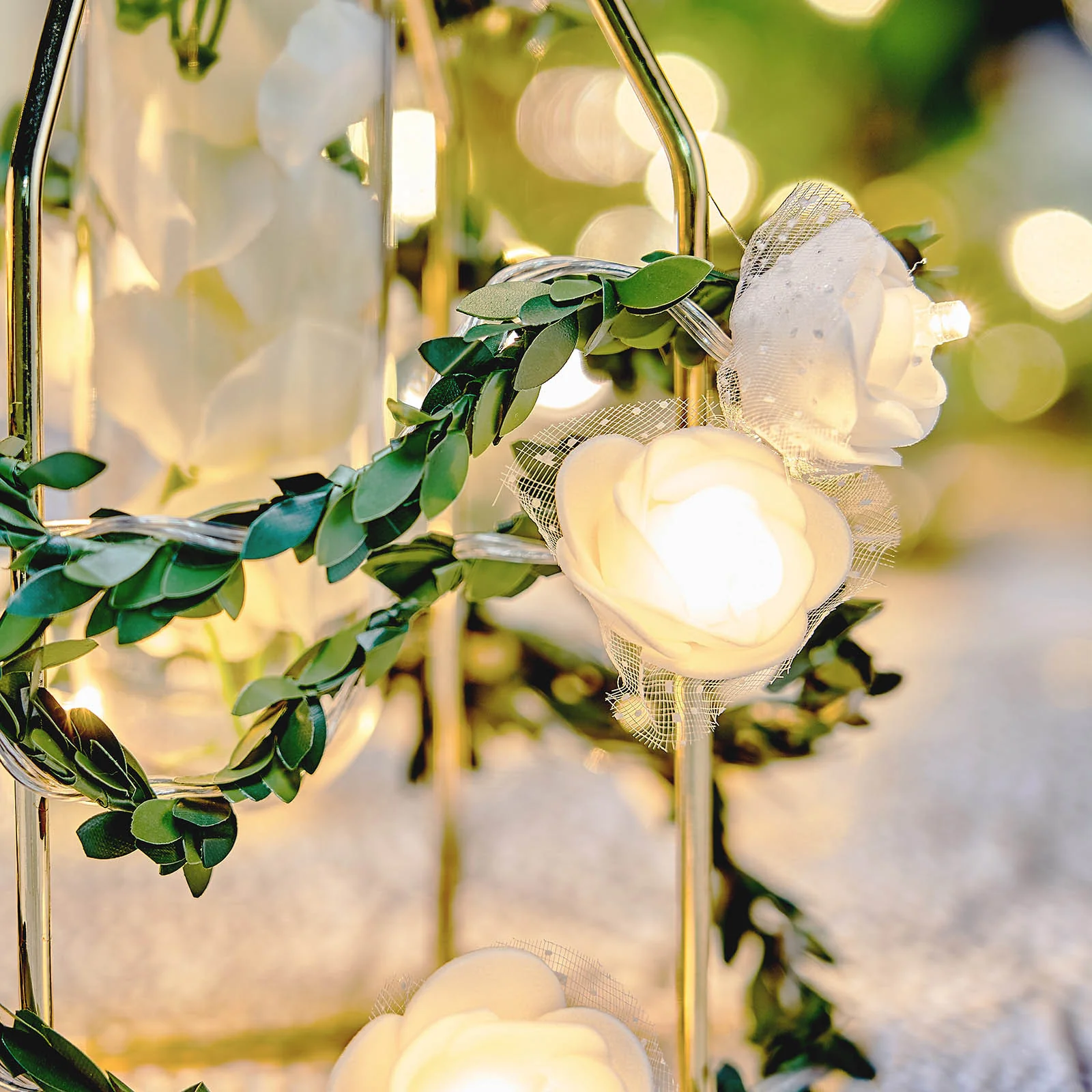 This Warm White 20 LED Faux Rose Lace Garland Vine String Lights is the perfect decoration for any occasion, be it formal or casual. It is made of high-quality artificial flowers and lace petals, and is decorated with LED light beads, enough for your guests to take photos and take pictures. It&