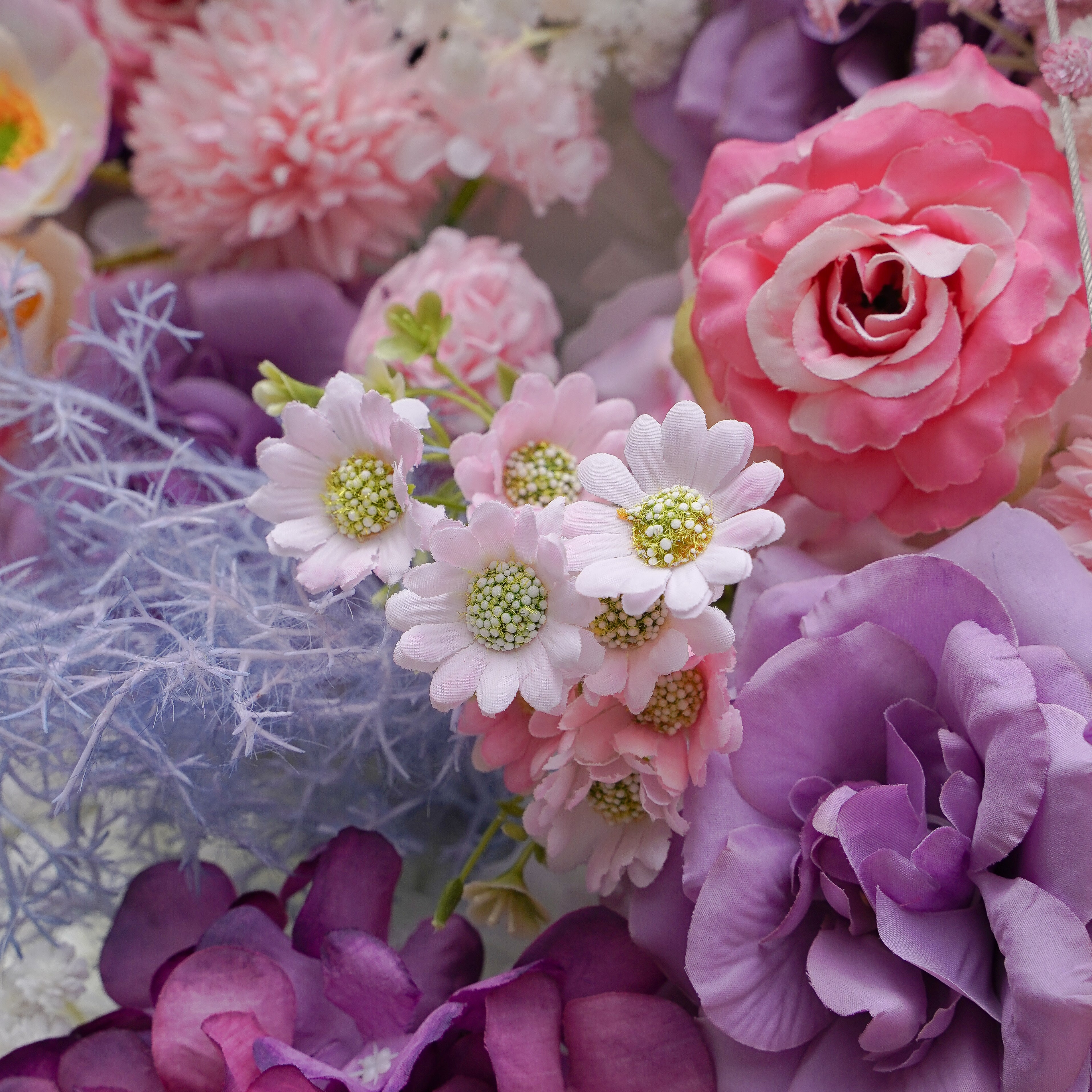 Rose Morning“The flower walls are made of artificial flowers in various colors, layered at different levels to create a lush, elegant and natural look. The exclusive zipper design and roll-up design make it easy to install and remove.”