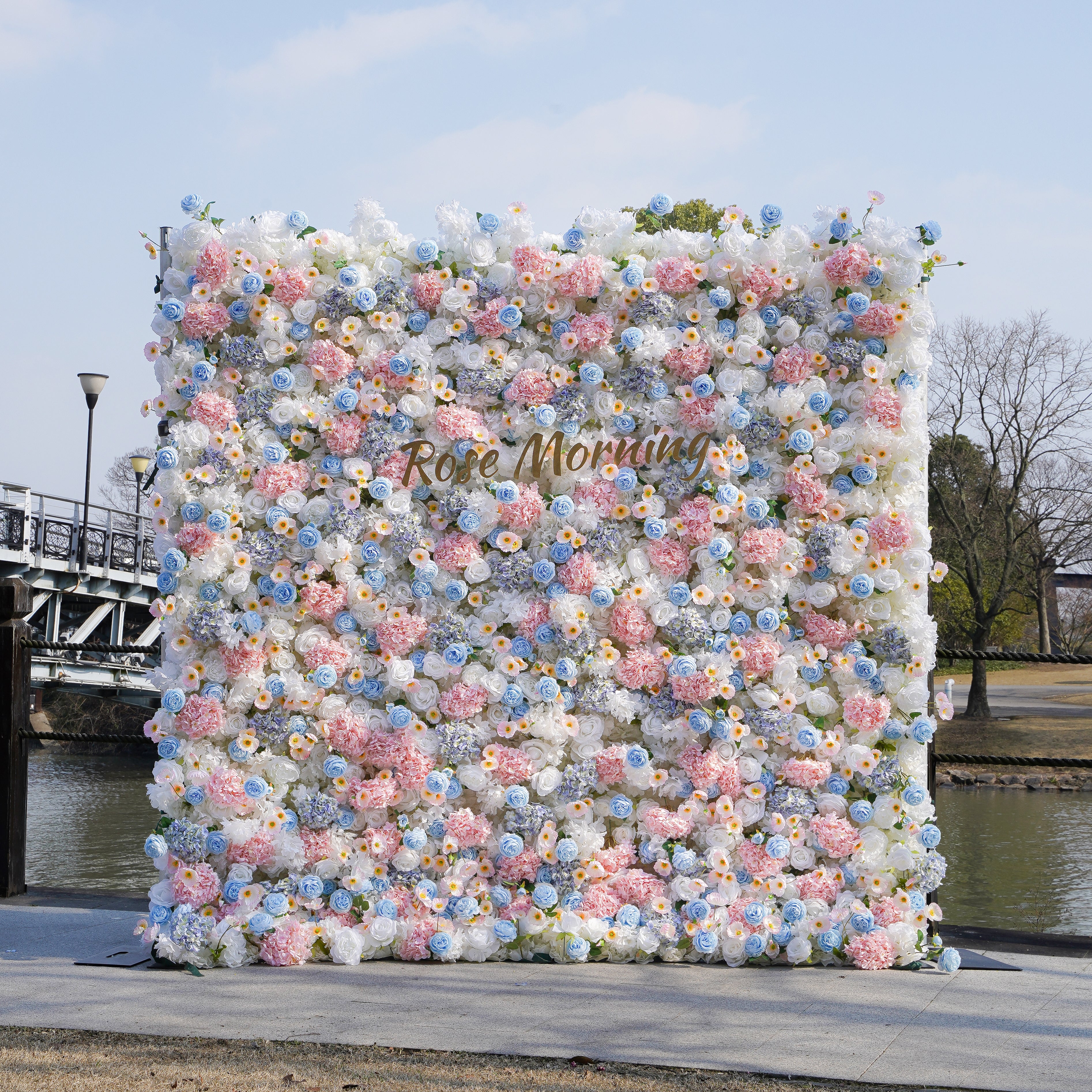 Rose Morning“The flower walls are made of artificial flowers in various colors, layered at different levels to create a lush, elegant and natural look. The exclusive zipper design and roll-up design make it easy to install and remove.”