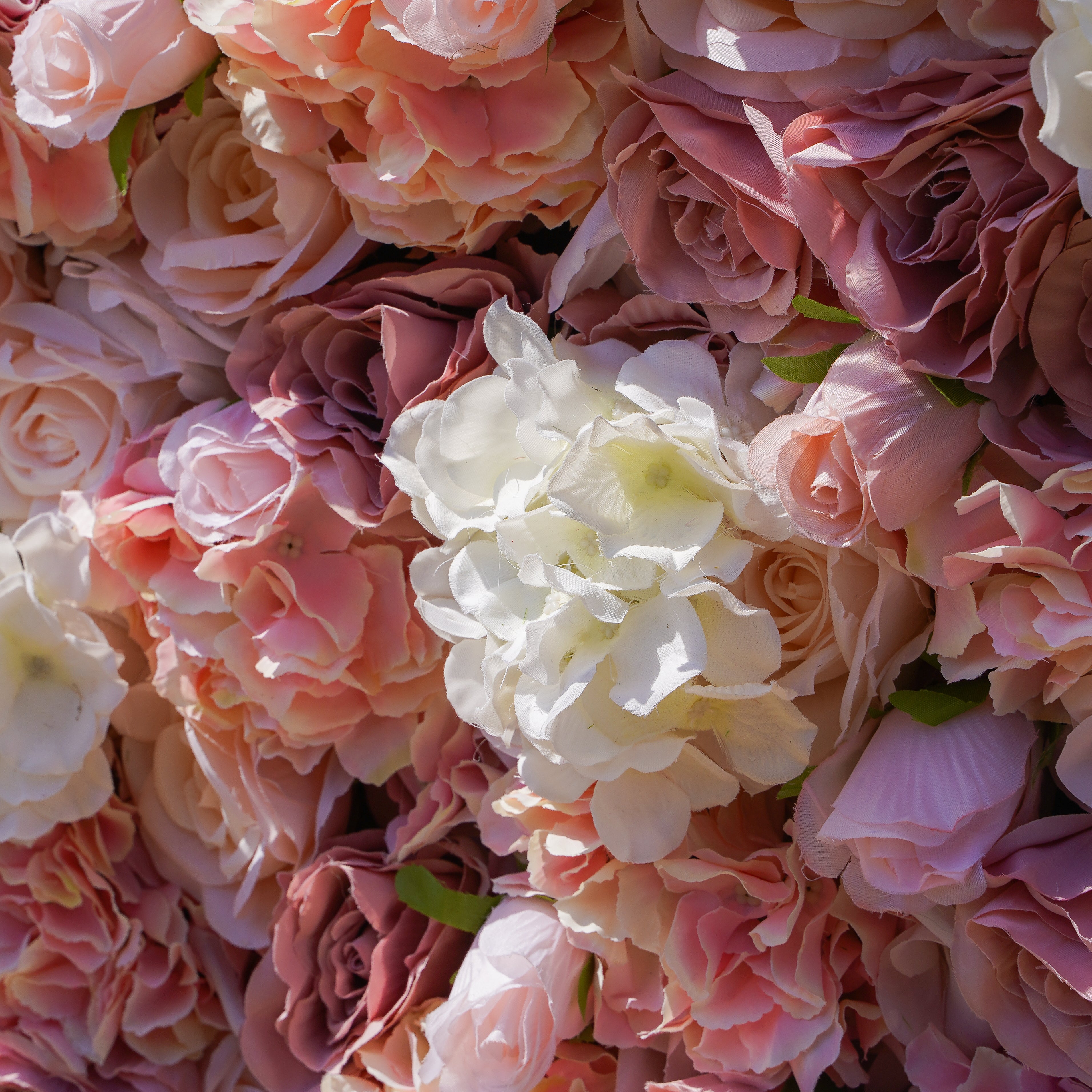 Rose Morning“The flower walls are made of artificial flowers in various colors, layered at different levels to create a lush, elegant and natural look. The exclusive zipper design and roll-up design make it easy to install and remove.”
