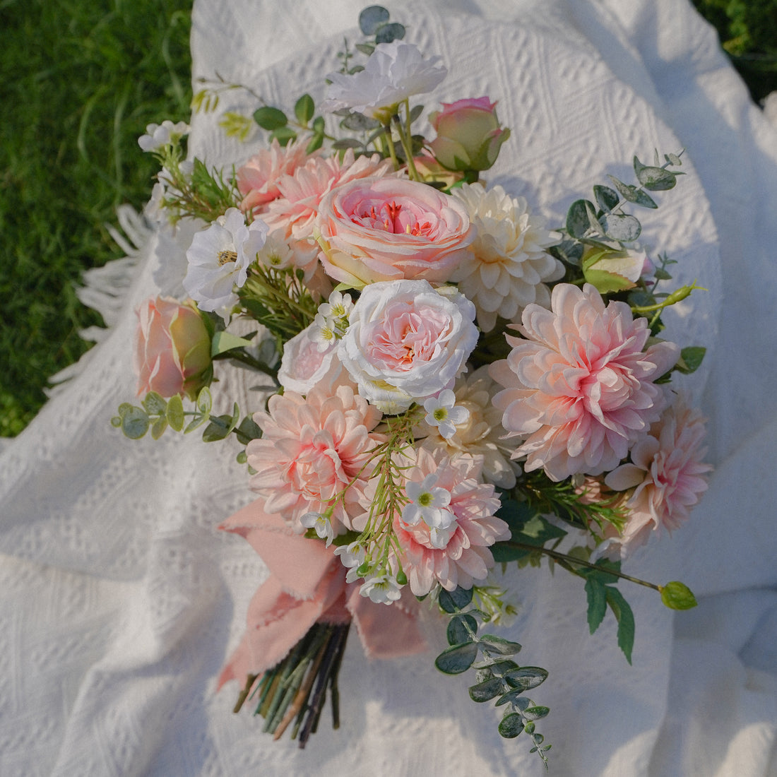 This pink fantasy wedding bouquet is the perfect accompaniment to any wedding. It is made of high quality flowers including pink roses, pink hydrangeas and pink daisies. The bouquet is decorated with ribbons and lace, very elegant. It is the perfect accessory for any bride and is sure to make her the center of attention at her wedding.