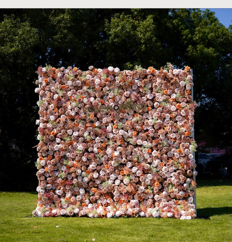 Blush and peach Rose Morning flower wall set up on a lawn