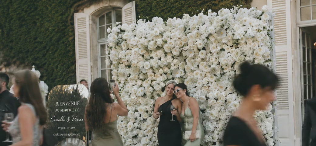 Wedding flower wall at an outdoor reception