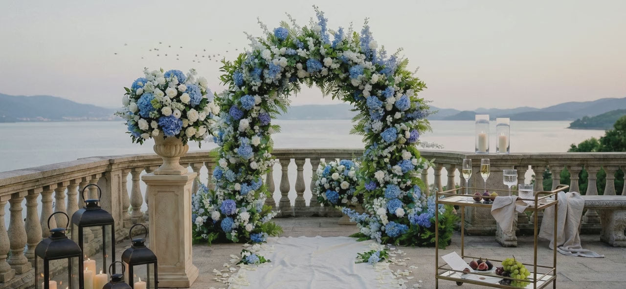 Ronya blue and white floral arch overlooking the water
