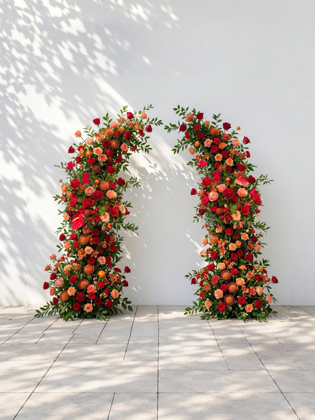 Velyne: Deep Red, Warm Orange &amp; Coral Anthurium Silk Floral Ground Horn Arch Arrangement with Soft Sorelia &amp; Lush Cascading Greenery for Romantic Minimalist Weddings &amp; Garden Event Decor Including Frame