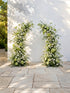 Raeldelle: Luxury White Silk Floral Arch Arrangement with Cascading Greenery for Romantic Weddings & Garden Event Decor Incuding Frame